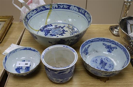 A 19th century Chinese blue and white punch bowl, Diameter 35cm. and three other bowls (a.f.)